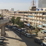 A bustling real estate office in North Karachi, showcasing investment opportunities.