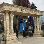 The main entrance of Taxila Museum, showcasing its historic architecture and grand pillars.